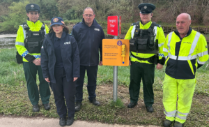 Standing at the riverside, beside an emergency throw line, are (left to right): Sergeant Griffith; Kyra Devine, Cadet Community Rescue Service, Ivan Barr, Community Rescue Service District Commander, Constable Deeney, and William Humphrey from Derry City & Strabane District Council