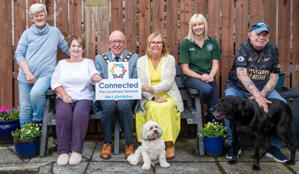 The Mayor of Mid and East Antrim, Cllr Jackon Minford, Mid and East Antrim Loneliness Network Chair, Marjorie Hawkins and Kerry Fokkens, Carnfunnock Principal Parks Duty Officer, were joined by residents of Wovens Scotch Quarter apartments to launch the Chatty bench located in their courtyard.