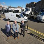 Mayor Jackson Minford with Council staff and new refuse collection vehicles.