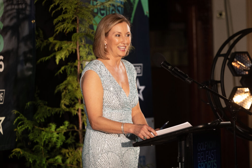 Event host Claire McCollum presenting on stage at the GolfNow Belfast Sports Awards 2026.