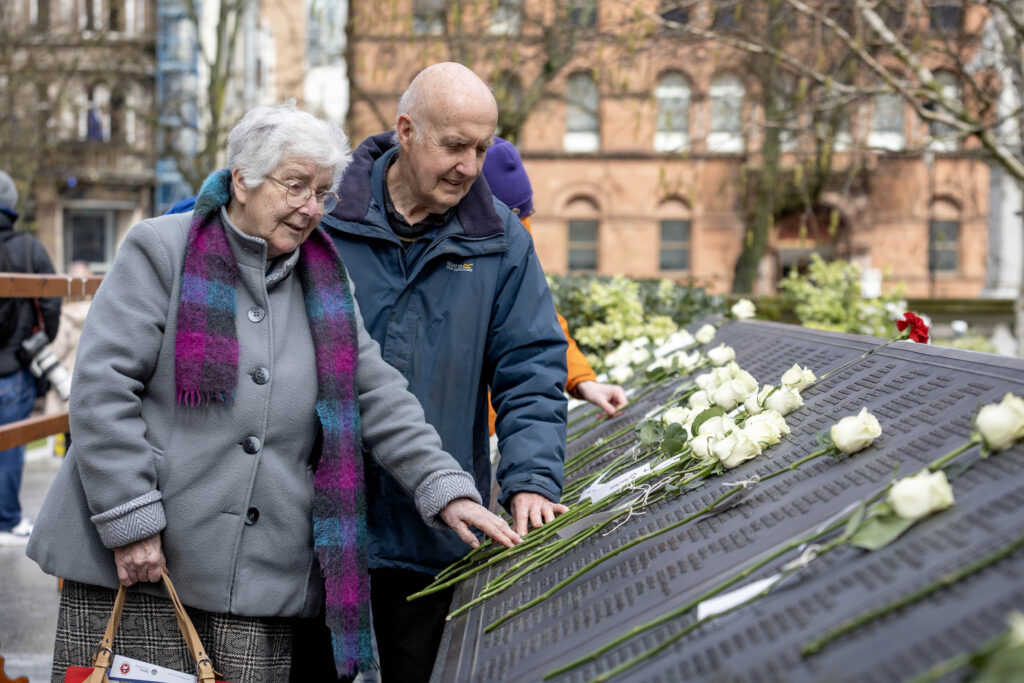 Mildred Irvine and her brother Bernard King lay white roses at the Titanic Commemoration Service to remember their relative Ernest King, Clerk and Assistant to the Purser on RMS Titanic, who lost his life at sea 114 years ago.  He is buried, along with other victims of the tragedy, at Fairview Lawn Cemetery, Halifax, Nova Scotia.