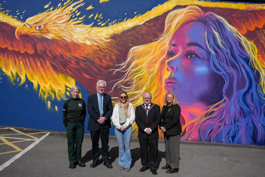 Speakers at the Mural Launch (L-R): Joni Beatty -  PSNI, Pat Blake – Enniskillen BID, Hannah Constance – Artist, Cllr Barry McElduff, Chair of Fermanagh and Omagh District Council, and Fionnuala French of The Executive Office
