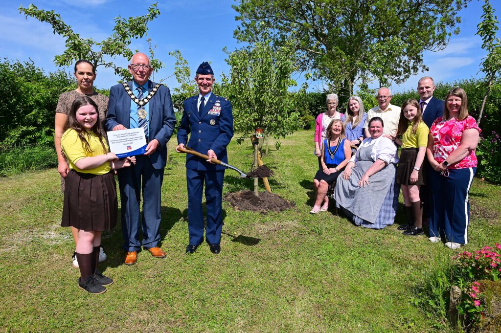 Pupils Rosie and Farrah with teacher Melissa Gibson, Buick Memorial Primary School are pictured with the Mayor of Mid and East Antrim, Councillor Jackson Minford; Paul Roelle from the US Consulate; Liz Hoy, Cullybackey Historical Society; Mayoress Allison Minford; Nicola McFall, Cullybackey Historical; Alderman Tom Gordon, MEABC; Mary; Matt McDowell, Director of People at the Council and Emma Minford.