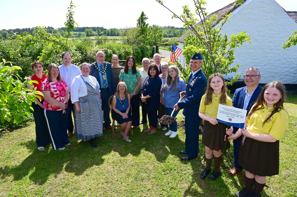 Paul Roelle from the US Consul is pictured with Mayor of Mid and East Antrim, Councillor Jackson Minford; Mayoress Allison Minford; Liz Hoy and Nichola McFall, Cullybackey Historical Society; Matt McDowell, Director of People at MEABC;  Rosie and Farrah, Buick Memorial Primary School; Alderman Tom Gordon; Emma Minford; tourism and civic officers from the Council and Robert and Mary from President Arthur Homestead.