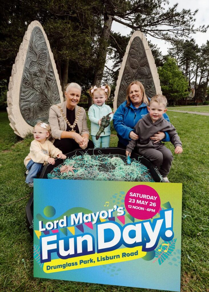 Amelia Stewart-Mackin, August McDonagh, Paula Goldsborough (Early Learning Coordinator with South Belfast Sure Start) and Noah-James Hughes join the Lord Mayor of Belfast, Councillor Tracy Kelly, to highlight a free family fun day at Drumglass Park on Saturday 23 May.