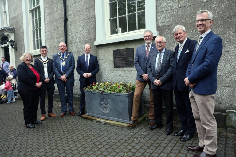 Communities Minister Gordon Lyons is pictured at the unveiling of the UNESCO plaque at Gracehill along with (L-R) Sarah Groves, former Bishop of Gracehill Moravian Church, outgoing Deputy Mayor, Councillor Tyler Hoey, outgoing Mayor of Mid and East Antrim, Councillor Jackson Minford, Alderman William McCaughey, Alderman Thomas Gordon, Her Majesty’s Lord Lieutenant Mr David McCorkell and Chair of Gracehill Old School Trust, Dr David Johnston OBE.