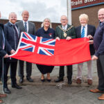 Pictured (l-r) with the Mayor of Mid and East Antrim, Alderman Thomas Gordon at the Red Ensign flag raising at Larne Harbour are: Matt McDowell, Director of People, Mid and East Antrim Borough Council; John Stewart MLA; Rowan Moore, Director of Place Mid and East Antrim Borough Council; Jane Allen DL, Deputy Lieutenant for County Antrim; Alderman Robert Logan and Councillor Matthew Warwick.