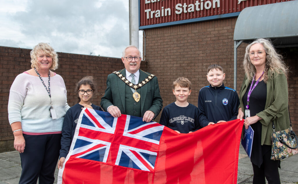 The Mayor of Mid and East Antrim, Alderman Thomas Gordon with the Principal of Olderfleet Primary School, Mrs. Galbraith and representatives from the school.
