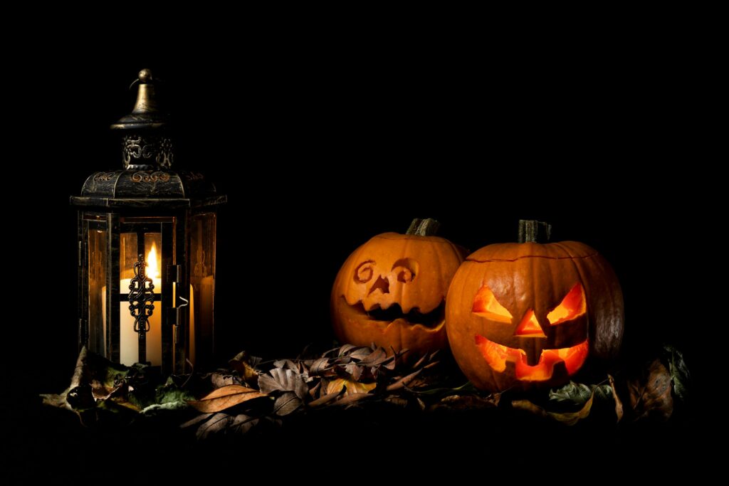 Illustrative Halloween pumpkins and lantern; not a photograph of the Purple Turnip Festival.